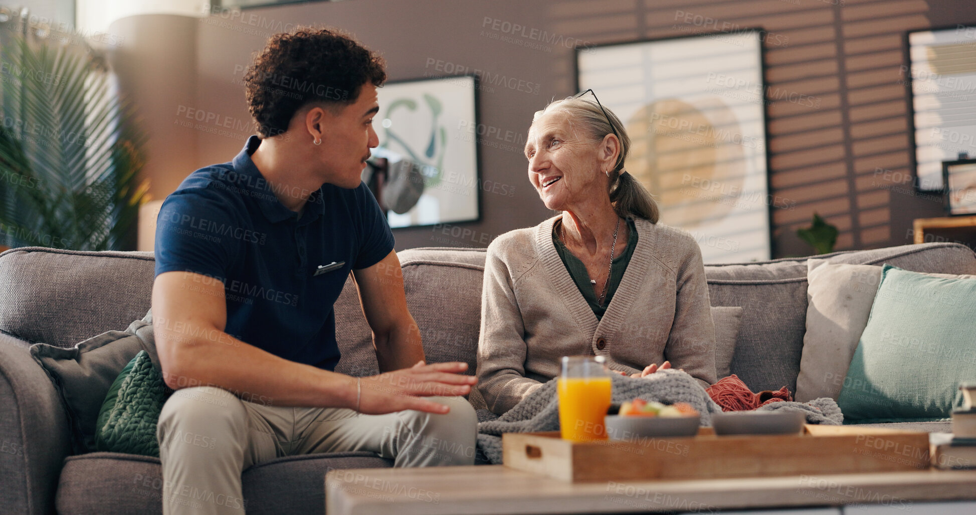Buy stock photo Happy, patient and talk with caregiver in nursing home, medical help or conversation with old woman. Assisted living, people and chat with nurse in lounge, retirement or smile for discussion in house