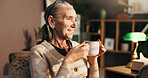 Senior woman, tea and thinking on sofa with happy memory, daydreaming and peaceful in retirement. Relax, elderly person and smile with warm beverage in home for reflection, remember and wondering