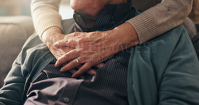 Buy stock photo Hug, hands and elderly couple in home, bonding and affection for relationship in lounge and comfort. Retirement, care and love in living room, senior people and embrace for support in house or trust