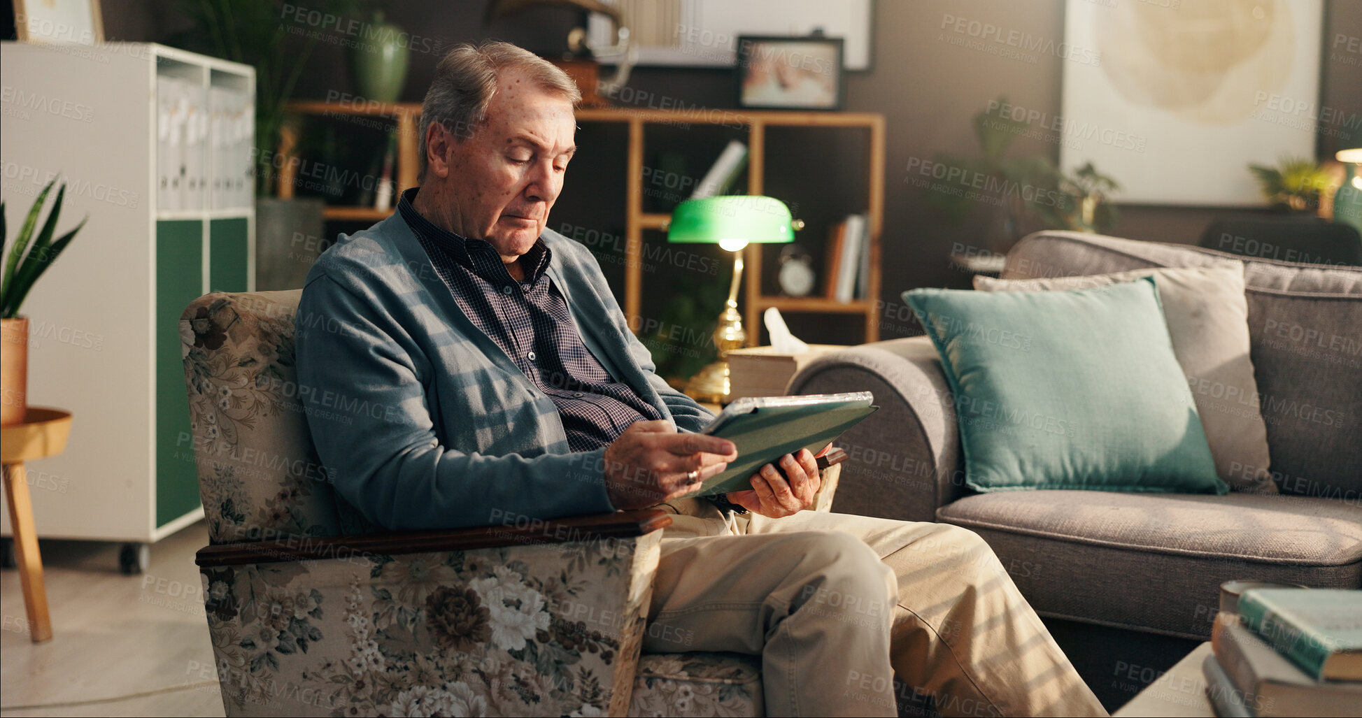 Buy stock photo Home, senior man and tablet on sofa for reading online news, retirement ebook or gambling website. Relax, elderly person or digital app in living room for web surfing, playing bingo game or streaming