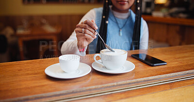 Buy stock photo Hands, cafe and woman stirring coffee on table for beverage, espresso and drink preparation. Cup, latte and customer with spoon for mixing morning cappuccino with fresh cream in restaurant to relax