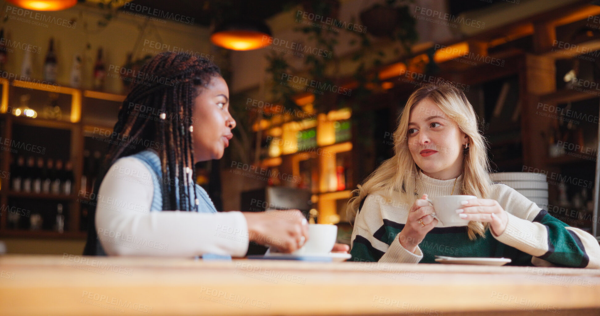 Buy stock photo Coffee shop, friends and women with drink in conversation for hangout, reunion and bonding. Restaurant, cafe and people with beverage, talking and gossip for relationship, social chat and relax