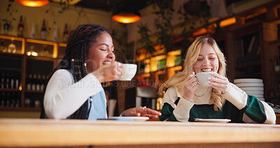 Coffee shop, friends and happy women with drink in conversation for hangout, reunion and bonding. Restaurant, cafe and people with beverage, talking and gossip for relationship, social chat and relax