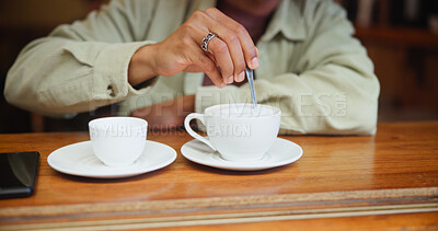 Buy stock photo Hands, cafe and stir coffee on table for beverage, espresso and customer with drink preparation. Cup, latte and man with spoon for mixing morning cappuccino with fresh cream in restaurant to relax