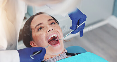Buy stock photo Dental mirror, oral health and dentist with woman for treatment of tooth decay, cavity or checkup. Consultation, hygiene and orthodontist with female patient for procedure with medical tool in clinic