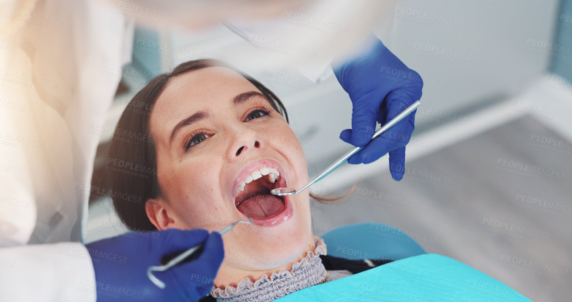 Buy stock photo Dental mirror, oral health and dentist with woman for treatment of tooth decay, cavity or checkup. Consultation, hygiene and orthodontist with female patient for procedure with medical tool in clinic