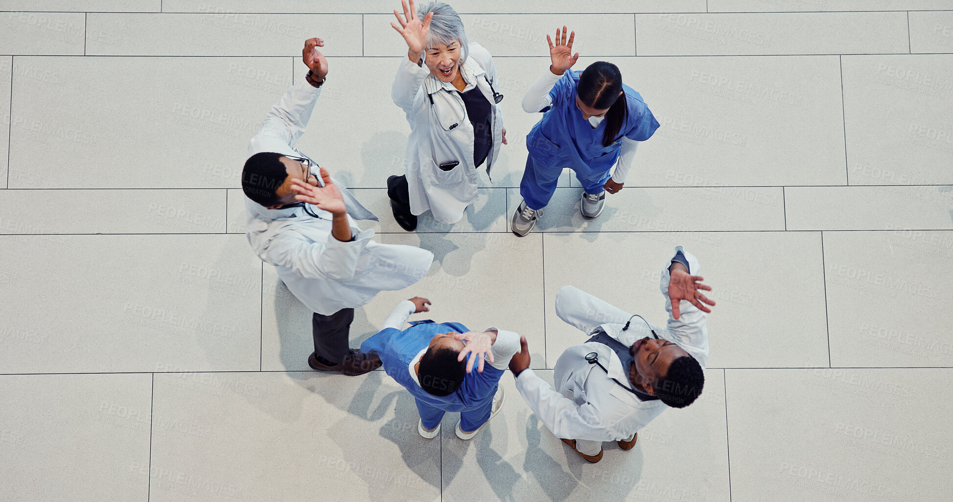 Buy stock photo Above, cheering and doctors in hospital, healthcare or celebration with support. People, group or medical service with wellness, excited or clinical trial success with results or funding for research