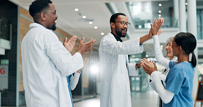 Buy stock photo Healthcare, doctor and group with smile, high five or clapping for success, celebration or hospital. Happy, medical professional and applause for achievement in clinic, support and gesture for win