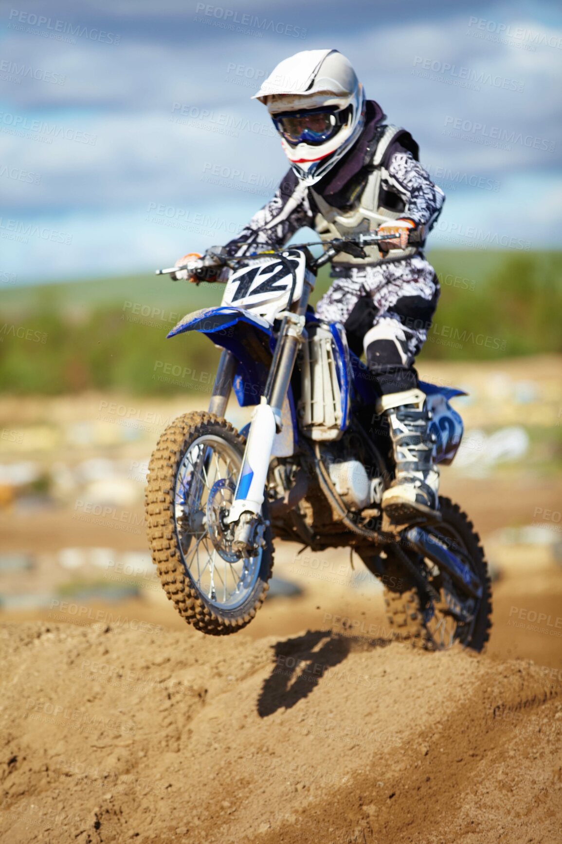 Buy stock photo Man, motorcycle and bike hill jump as professional rider in action danger competition, fearless or race. Male person, transportation or fast speed dirt adventure or rally, challenge gear or driving