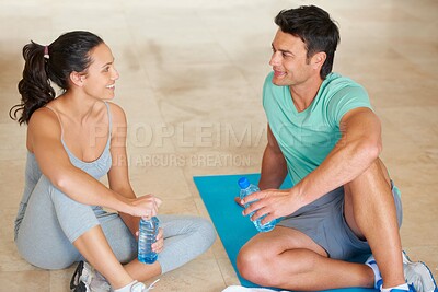 Buy stock photo Couple, fitness and talking on yoga mat after workout class in the gym for health and wellness. Man, woman and conversation after exercise or training for bonding or strong and sporty relationship 