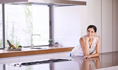 Buy stock photo Woman, relax and portrait in kitchen of modern house with granite counter, gas stove and happy homeowner. Property, real estate and person with pride for home, minimal interior design and space