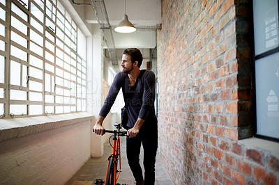 Buy stock photo Bicycle, travel and man in hallway, morning and eco friendly transport with break. Person, traveller and biker in lobby, commute and calm with environment, thinking and cycling with contemplation