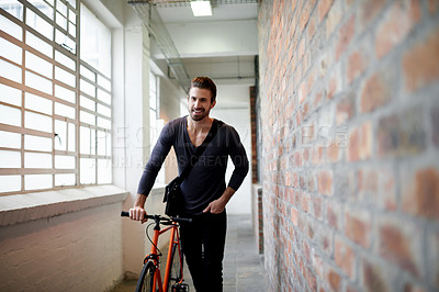 Buy stock photo Man, bicycle and happy in hallway at office by window, thinking and ready for ride on travel. Person, smile and bike in corridor for sustainability with eco friendly transportation on commute
