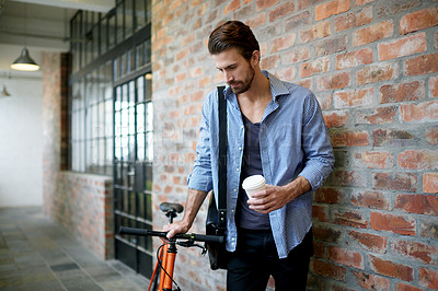 Buy stock photo Businessman, coffee and waiting with bicycle in hallway for local commute or travel in office building. Man, traveler or creative employee with bike for eco friendly transportation or ride to work