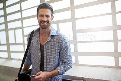 Buy stock photo Portrait, designer or happy man with phone by window for social media, online blog and app in office. Break, confident or creative male person with smile on mobile for startup business at workplace