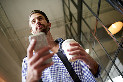 Buy stock photo Coffee, phone and walking with business man in office for communication, social media and planning. Networking, project update and client feedback with person from low angle in agency for mobile app