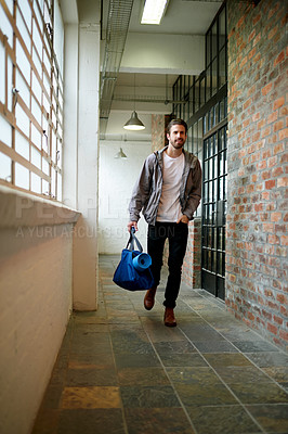 Buy stock photo Walking, gym and man with bag in corridor ready to start exercise, fitness and training. Sports athlete, health club and person with gear in hallway to workout for wellness, practice and wellbeing