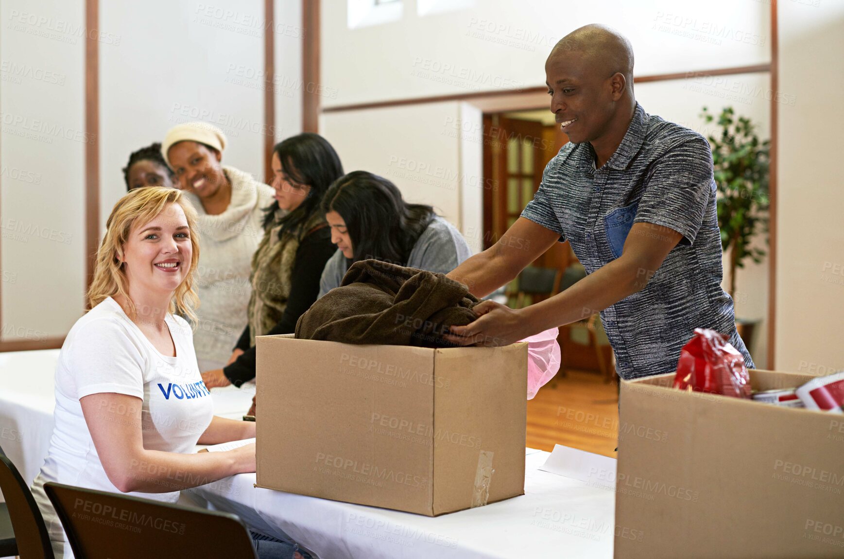 Buy stock photo Cropped portrait of a volunteer collecting donations of clothing
