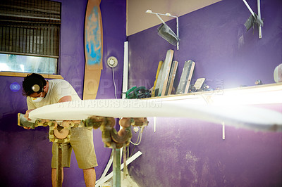 Buy stock photo Man, workshop and manufacturing with surfboard, design or career for water sport equipment in mask for safety. Person, process and ppe gear with tools, inspection or quality assurance at surf factory