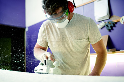 Buy stock photo Design, sanding and surfboard with man in workshop for manufacturing or production process. Earmuffs, face mask and goggles with person shaping product in surf studio for small business startup
