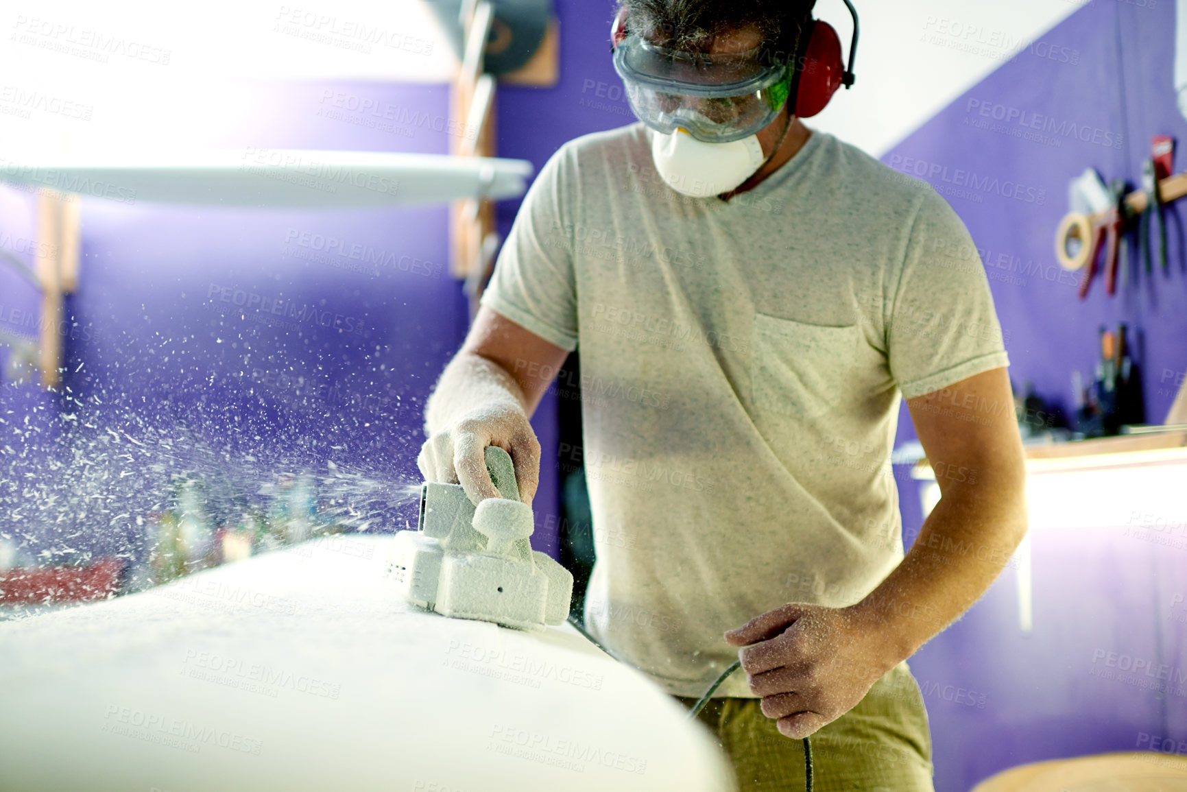 Buy stock photo Workshop, man and tools for shape of surfboard, grinder and entrepreneur with skills for design or craft. Small business, artisan and person with machine for creation, manufacturing and polishing