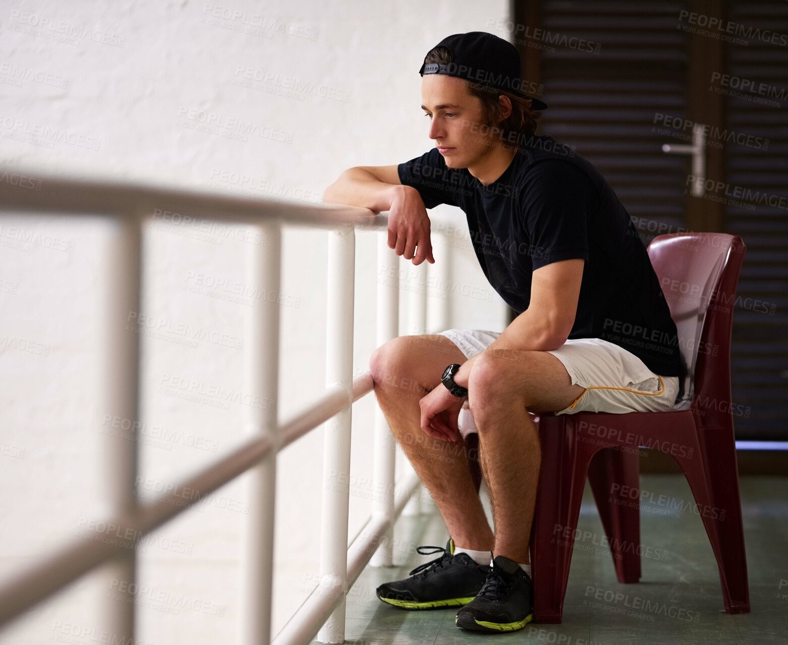 Buy stock photo Sports, watching and man on chair in court or arena for training, match and practice to support or relax. Squash, fan and person in audience looking at workout, competition tournament or indoor game