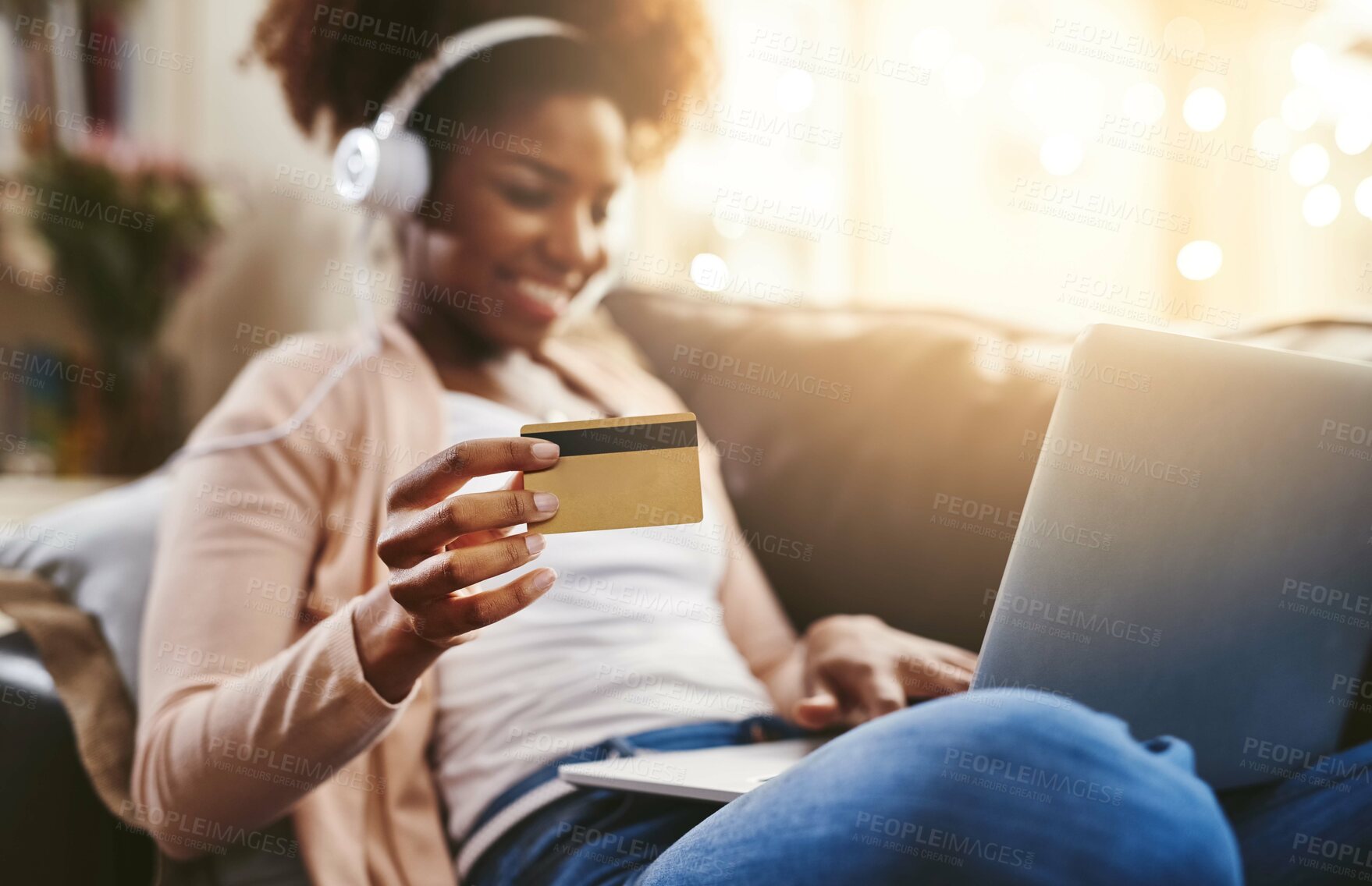 Buy stock photo Headphones, laptop and woman with credit card on sofa for online shopping, internet purchase and payment. Ecommerce, fintech and happy person at home for subscription, sales and digital banking