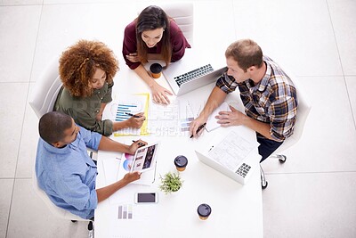 Buy stock photo Top view, office and business people in meeting, planning and documents with charts, feedback and cooperation. Collaboration, group or media analyst with ideas, paperwork or brainstorming with review