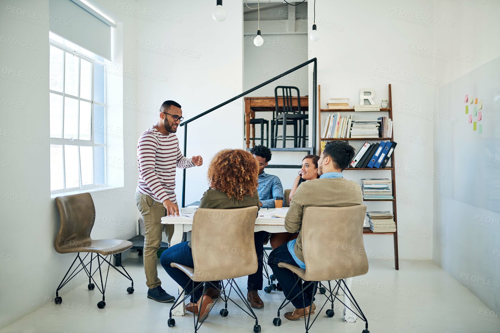 Buy stock photo Shot of a group of colleagues having a meeting in a modern office