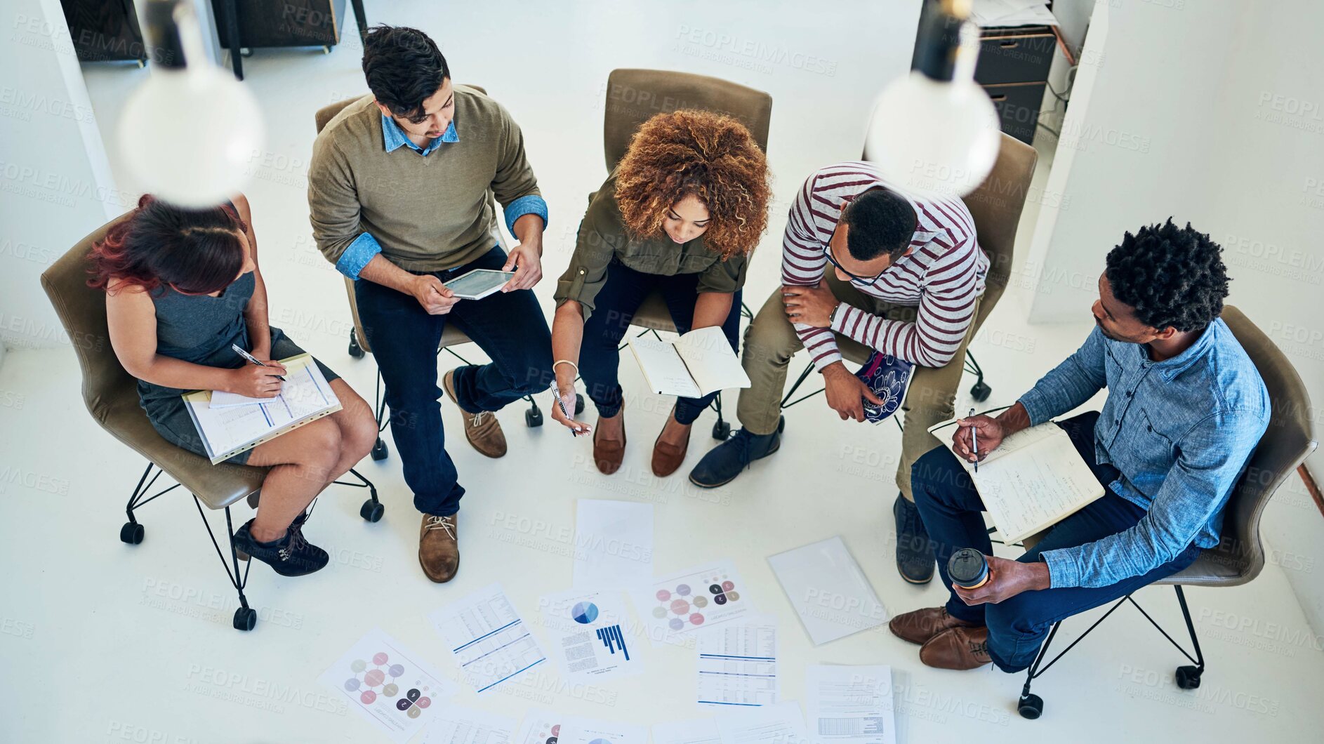 Buy stock photo Shot of a group of colleagues having a meeting in a modern office