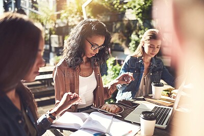 Buy stock photo Shot of creative employees holding hands and praying before breakfast outdoors