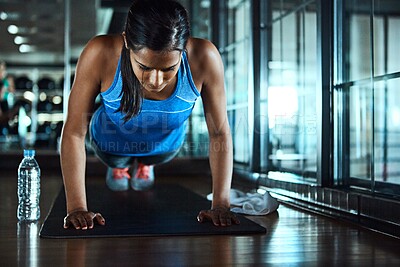Buy stock photo Sports, push up and woman in gym for workout with strength, wellness and arms training. Serious, health and female athlete with exercise for body goals for muscles and power in fitness center.