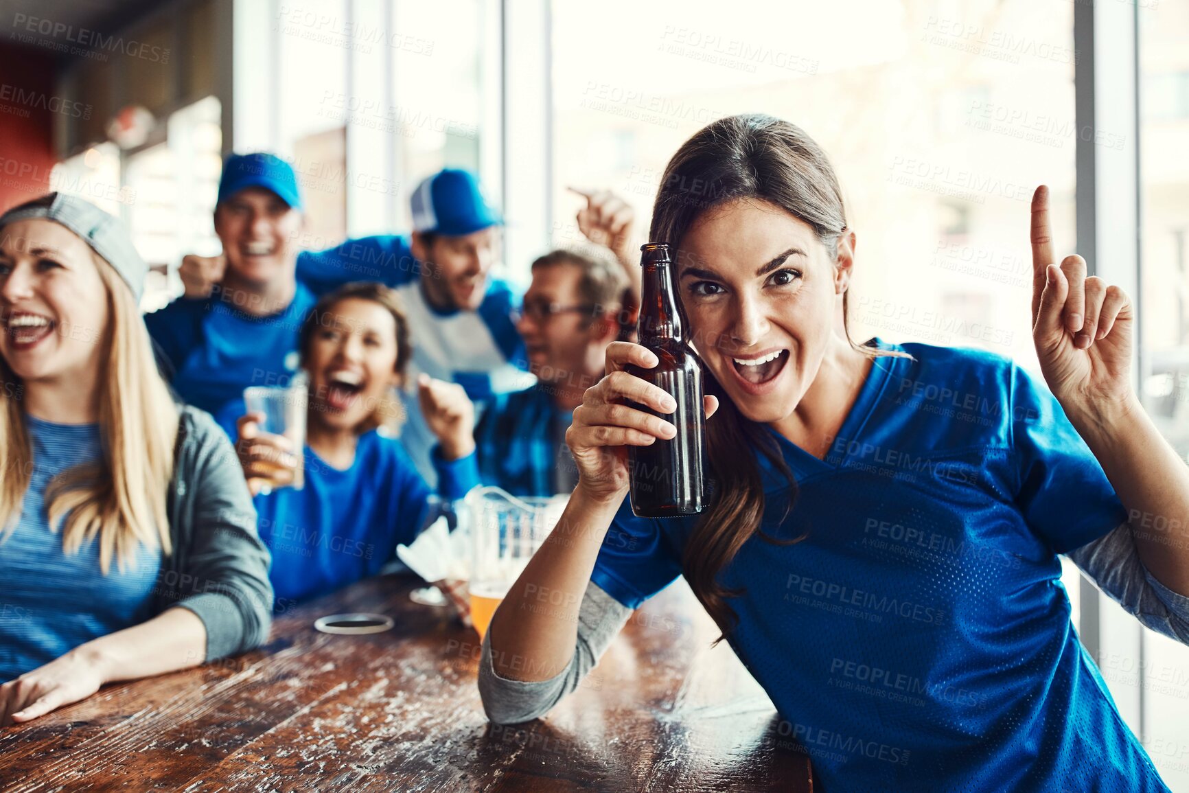 Buy stock photo Woman, supporters and team at pub, cheering for victory in sports on television with celebration for goal. Female person, fans and beer for football game or match as friends with loyalty in world cup