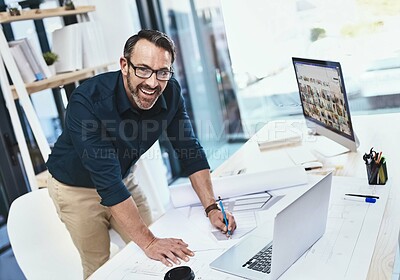 Buy stock photo Shot of a mature male architect working on his laptop