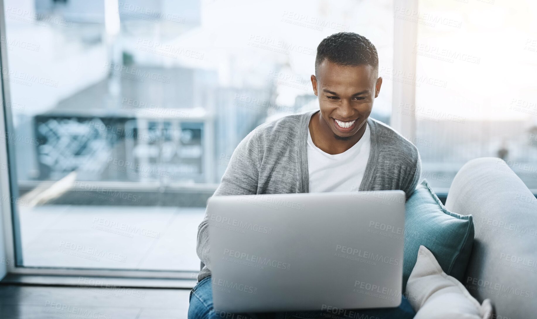 Buy stock photo Man, relax and laptop in home on couch, networking and social media for online streaming in living room. Happy, research and technology on website, remote work and internet blog in apartment