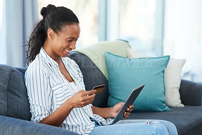Buy stock photo Relax, tablet and African woman with credit card on sofa for transaction, e commerce or online shopping in living room. Payment, app and person for purchase, subscription or internet banking in home