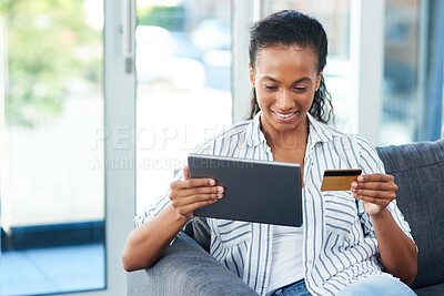 Buy stock photo Home, tablet and happy woman with credit card on sofa for transaction, e commerce or online shopping in living room. Payment, app and African person for purchase, subscription or internet banking