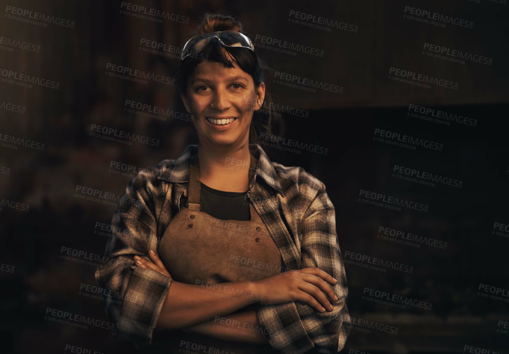 Buy stock photo Woman blacksmith, portrait and smile in workshop, industrial warehouse or trade with entrepreneurship. Small business owner, female entrepreneur or confident in factory, industry or metalwork artisan