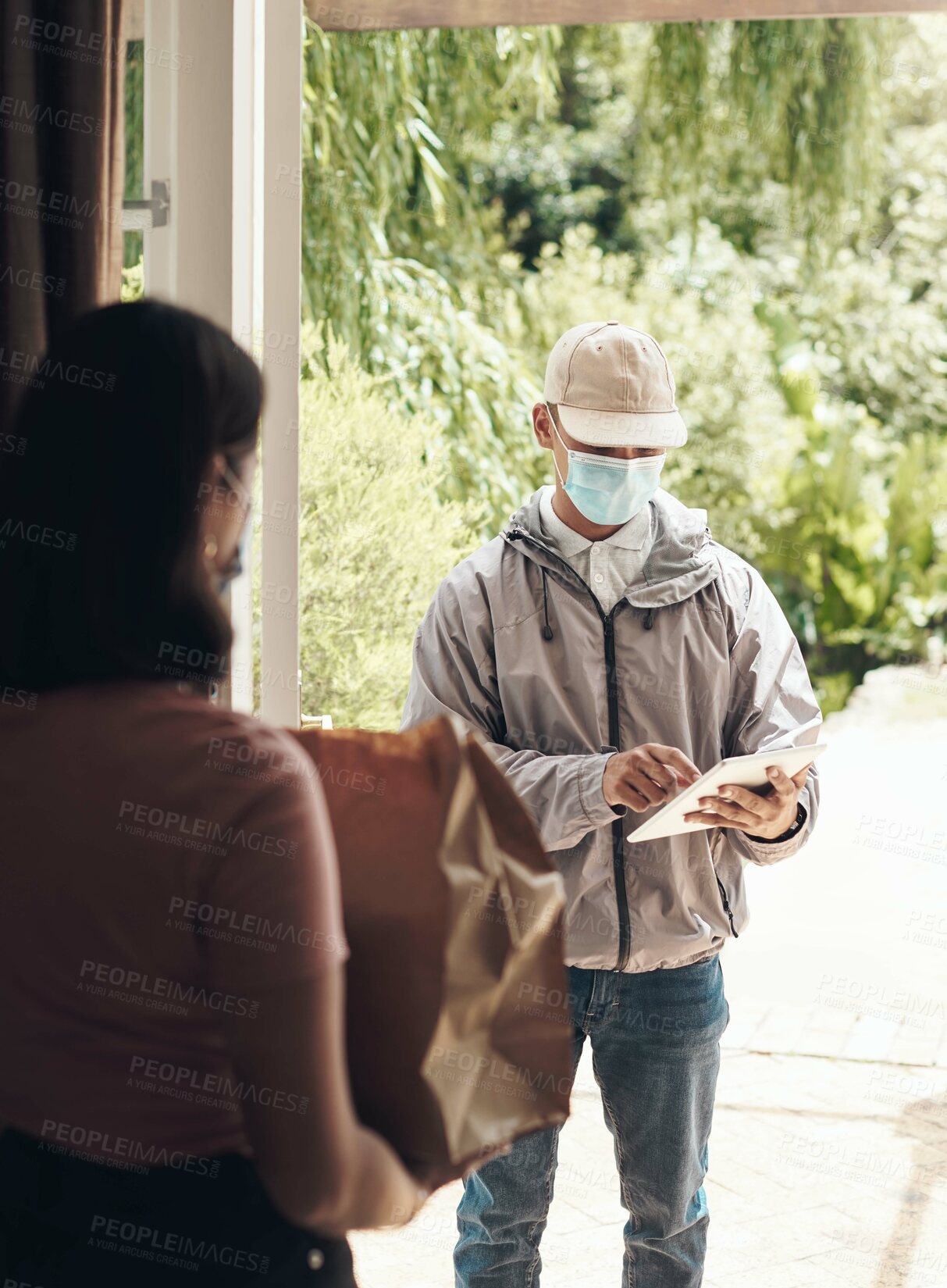 Buy stock photo Delivery man, package and clipboard at door, courier and face mask for shipment, e commerce and parcel. Woman, customer and  postage in logistics, safety compliance and online shopping on checklist