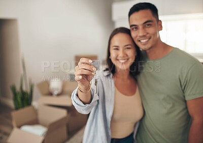 Buy stock photo Portrait, couple and happy in new home with keys for moving in, satisfied and confident with ownership. Property, relationship and smile with unpacking furniture, excited and positive with property