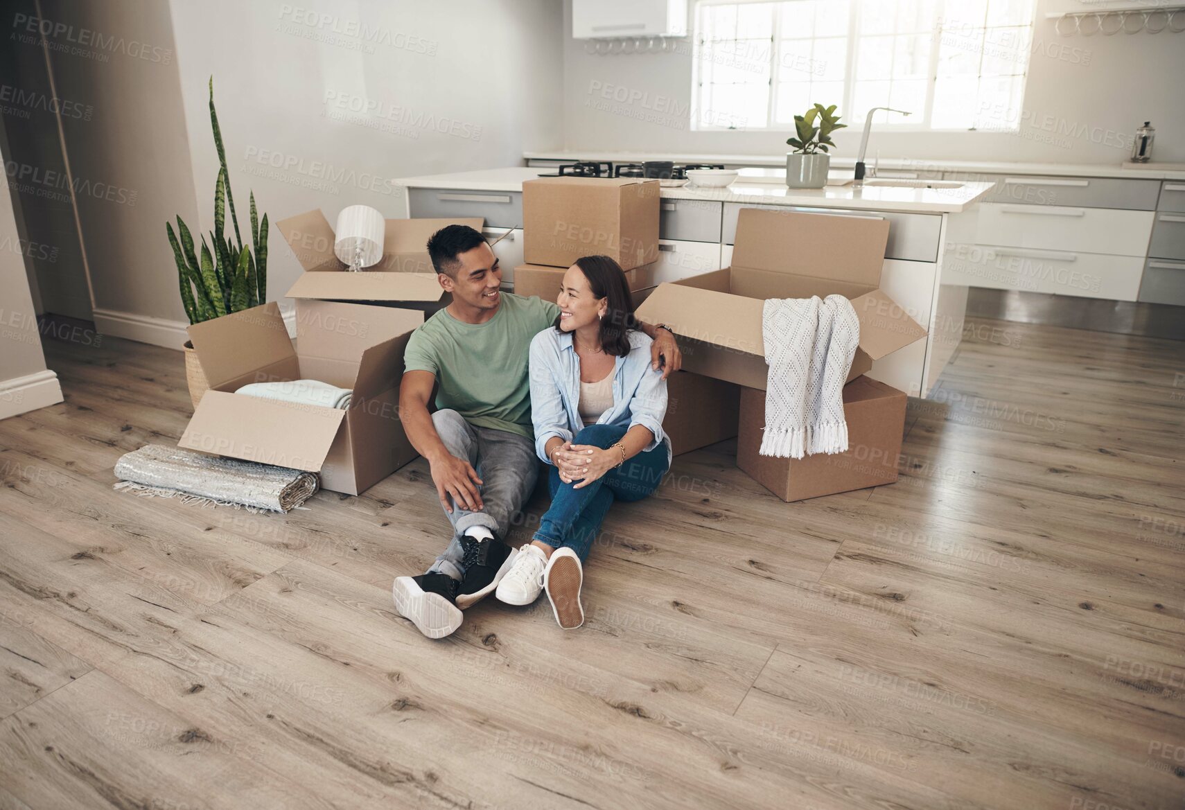 Buy stock photo Break, couple and smile in new home with boxes for moving in, satisfied and confident with ownership. House, relationship and happy with unpacking furniture, excited and positive with property