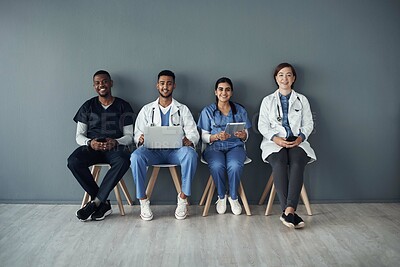 Buy stock photo Chairs, doctors and happy team by wall for interview or public health conference and training session or meeting. People, medical staff and line for patient rounds or daily briefing, review and proud