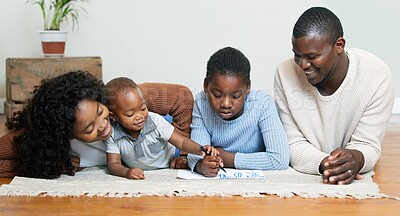 Buy stock photo Black family, drawing and lying on living room floor with children for bonding, learning or helping at home. African mother, father and kids with smile for sketching or childhood development at house