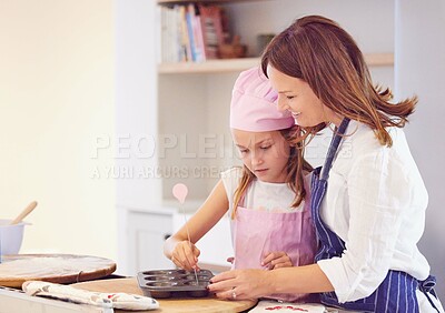 Buy stock photo Baking, family and tray in kitchen of home together learning how to cook or prepare fresh pastry. Equipment, smile or happy with mother and daughter in apartment to bake ingredients, food or recipe
