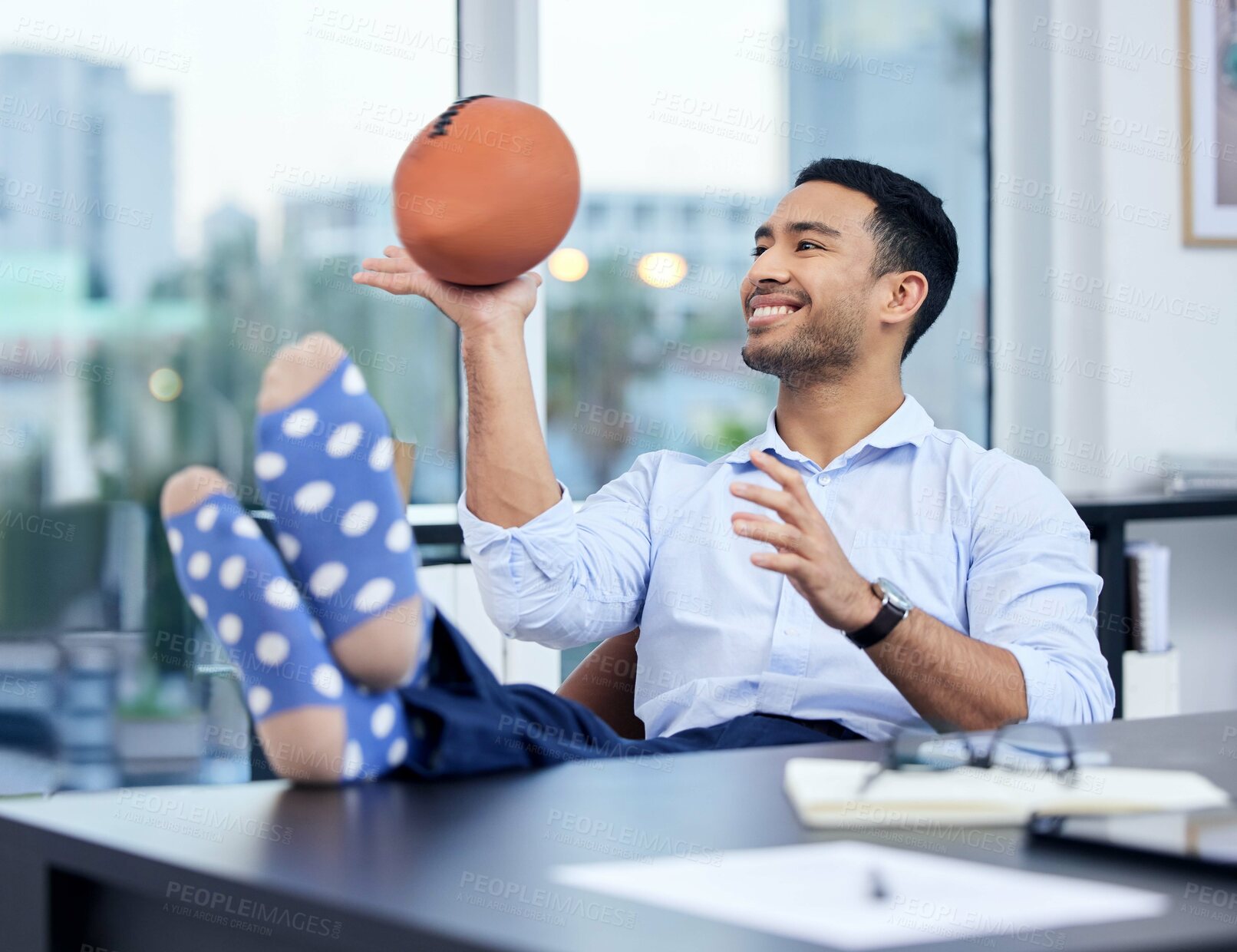 Buy stock photo Happy, businessman and ball to relax and rest after work for freedom and balance. Excited, male sports bettor and break after successful game or bet with budget review on financial margins of risk