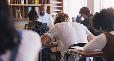 Buy stock photo Students, test and exam with writing, study and support for education and knowledge. Man, teenager and classroom with learning, teacher and high school development for future growth for question