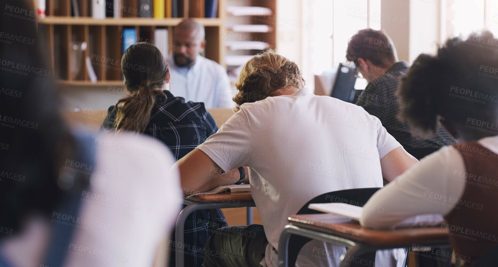 Buy stock photo Students, test and exam with writing, study and support for education and knowledge. Man, teenager and classroom with learning, teacher and high school development for future growth for question