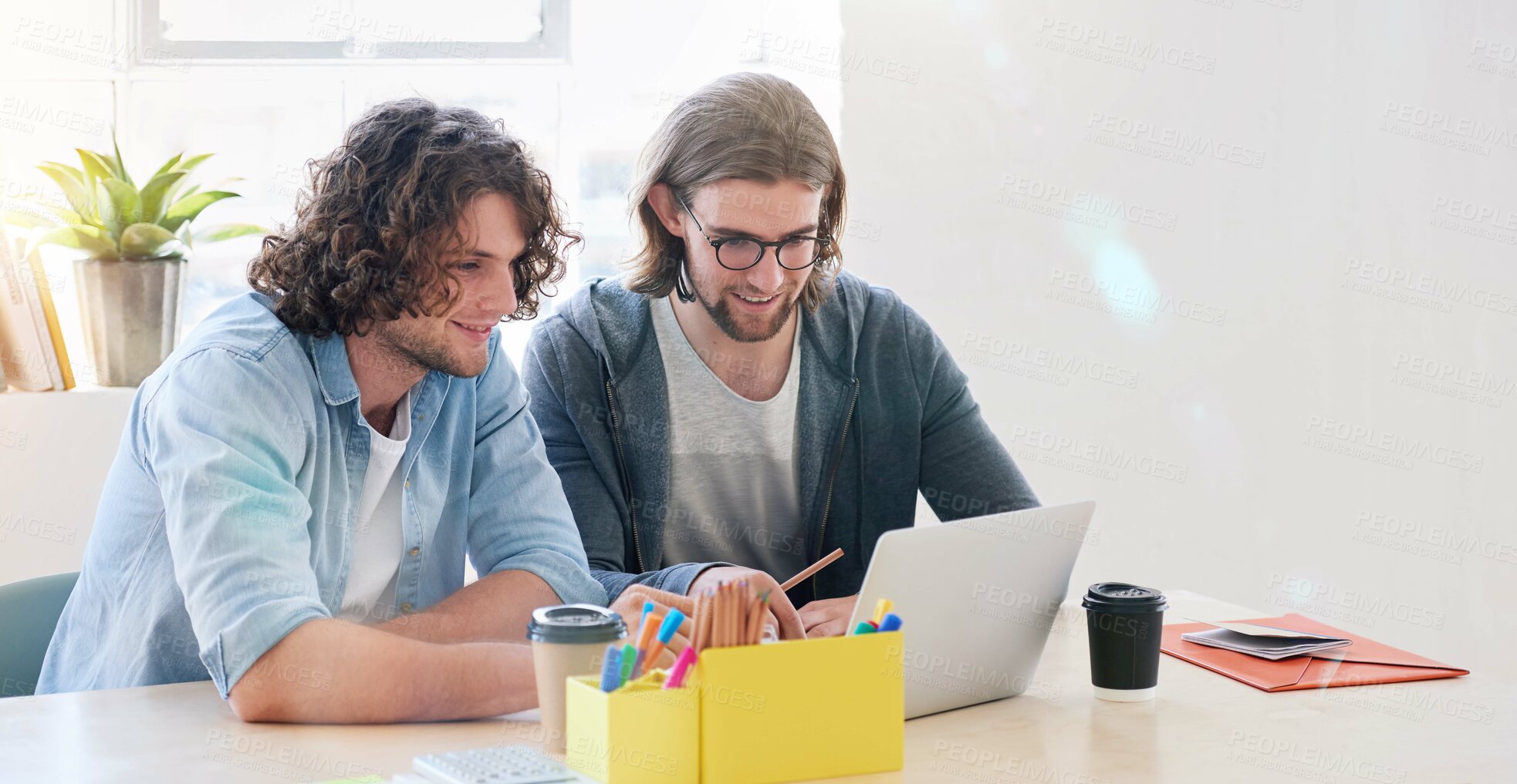 Buy stock photo College students working together two young men brainstorming ideas for project sitting at desk using laptop computer in class