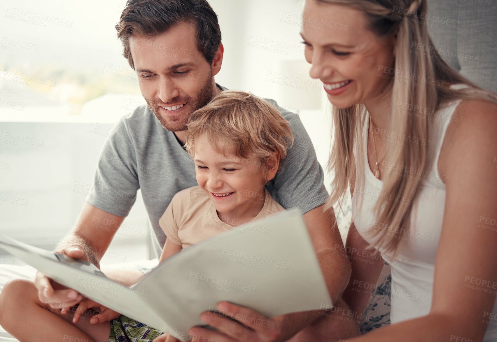Buy stock photo Parents, child and reading dinosaur books in family home for educational fun, learning and happy development in Australia. Mom, dad and kid playing, learning and laughing funny animal story together