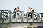 Big family, bridge and happy travel, vacation or holiday trip together outdoors. Family, generations and mom, dad and girl, grandma and grandpa spending time together, love and bonding in Canada.

